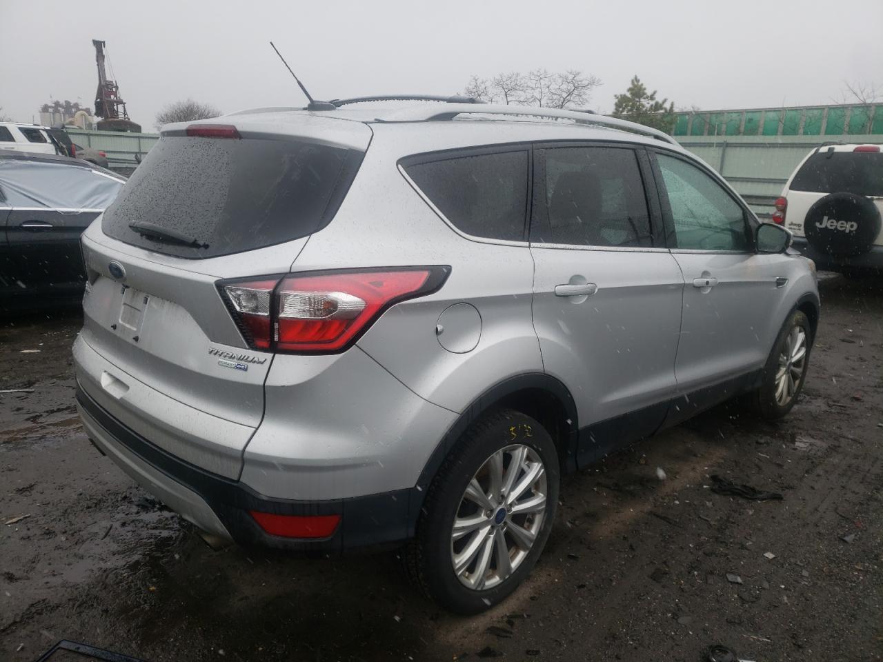 Photo 4 from auction – 2017 FORD ESCAPE TIT with VIN 1FMCU9J94HUD32901