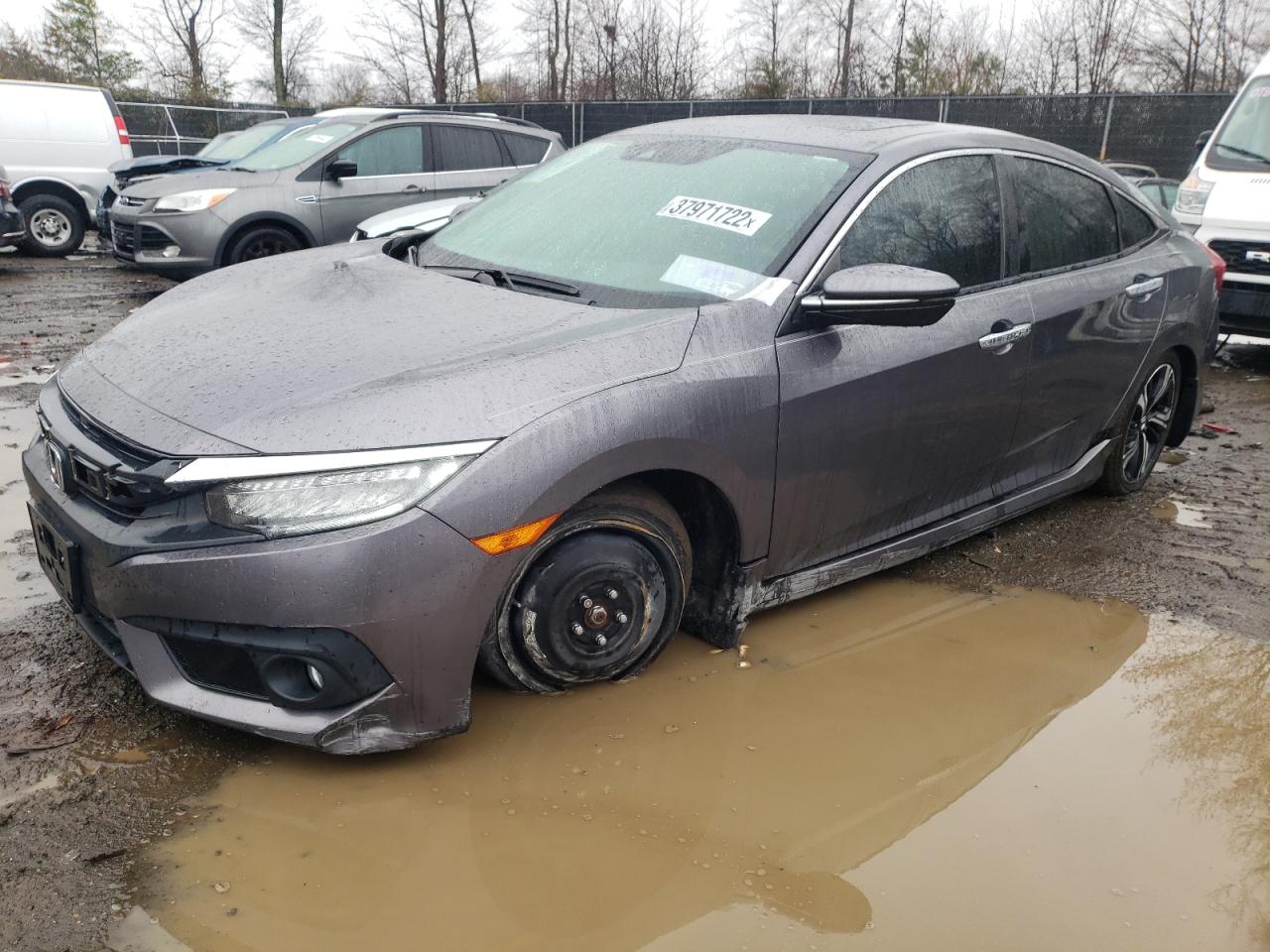 Photo 9 from auction – 2016 HONDA CIVIC TOUR with VIN 19XFC1F98GE223899