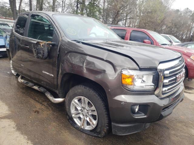 GMC CANYON SLE 2020 with VIN 1GTH5CEA2L1200478 - Photo from auction