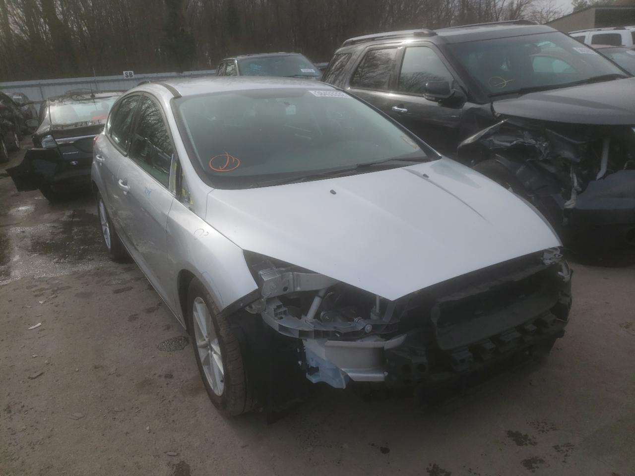 FORD FOCUS SE 2017 with VIN 1FADP3K22HL215702 - Photo from auction