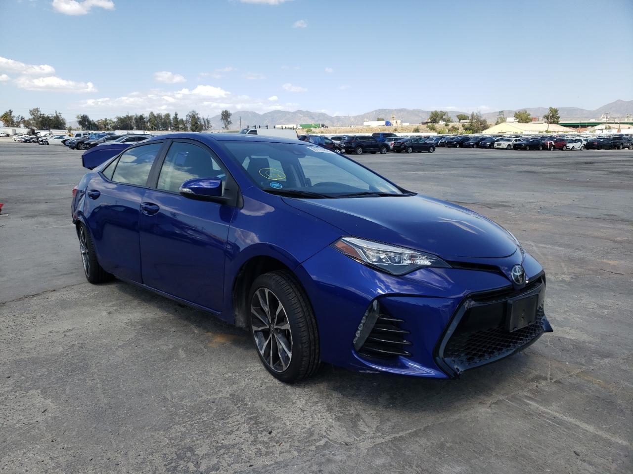 TOYOTA COROLLA L 2018 with VIN 5YFBURHE5JP765052 - Photo from auction