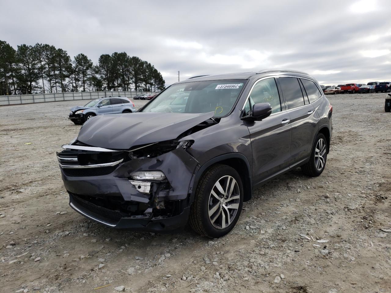 Photo 2 from auction – 2018 HONDA PILOT TOUR with VIN 5FNYF5H99JB025029