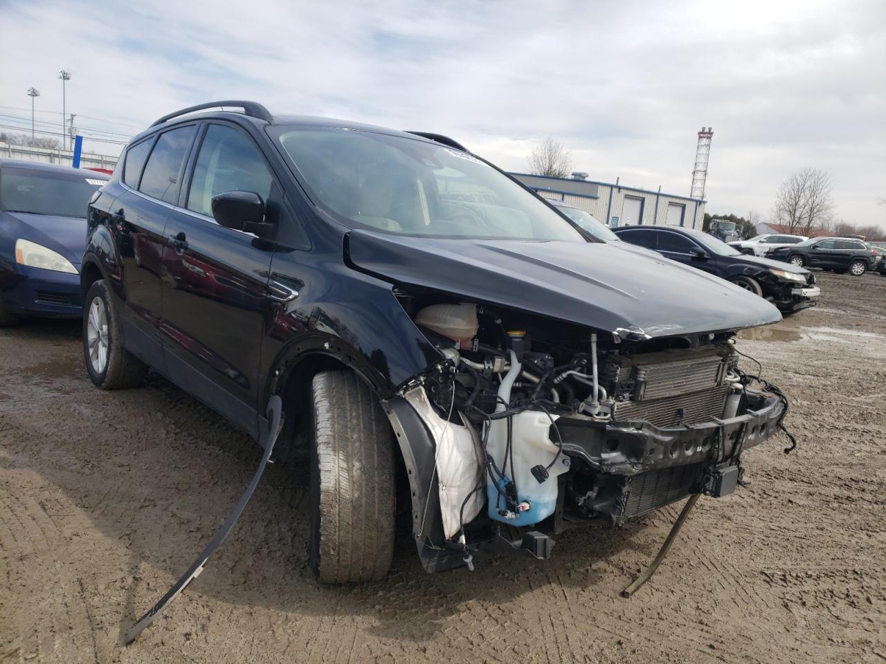 FORD ESCAPE SE 2018 with VIN 1FMCU9GD1JUC62999 - Photo from auction
