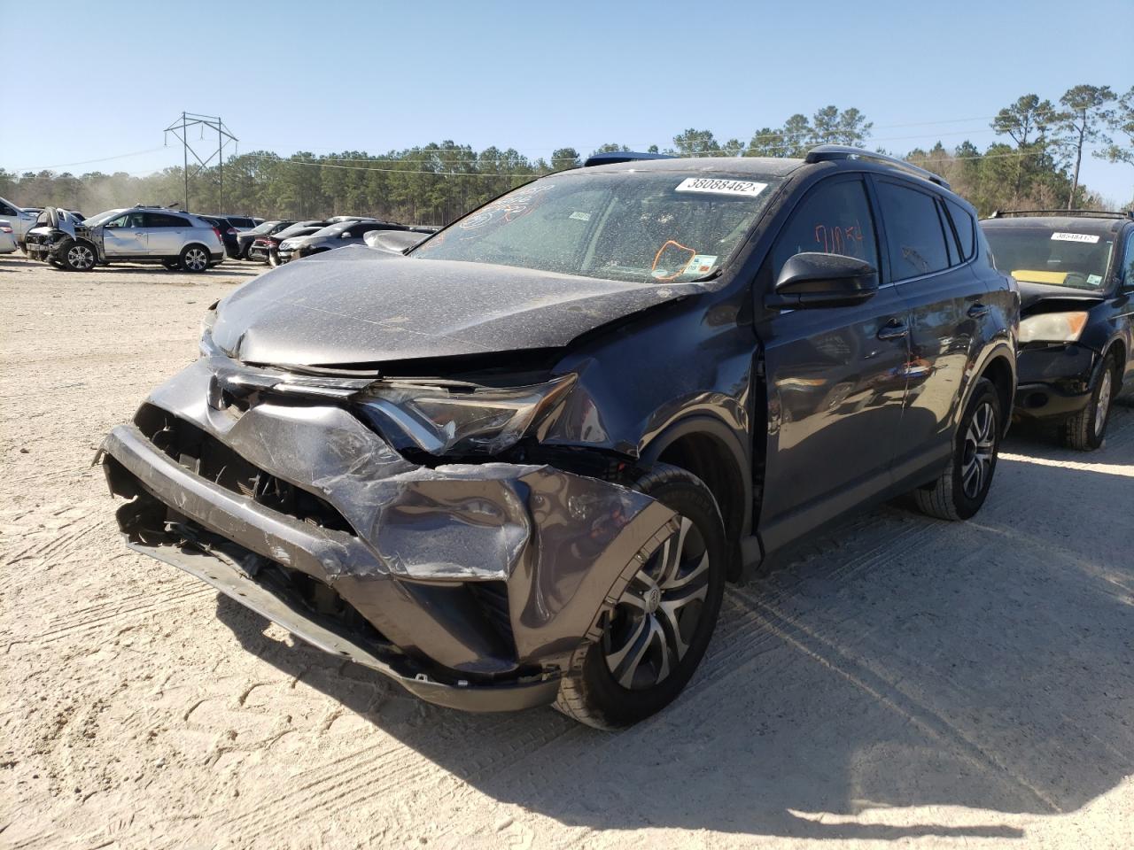 Photo 2 from auction – 2016 TOYOTA RAV4 LE with VIN JTMZFREV4GJ077540