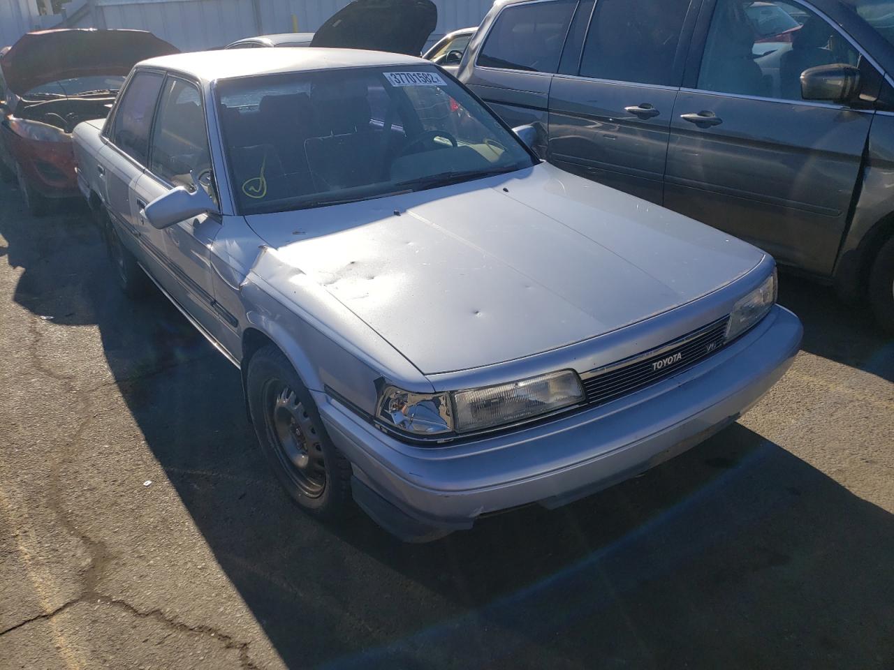 TOYOTA CAMRY LE 1989 with VIN JT2VV22E5K0048147 - Photo from auction