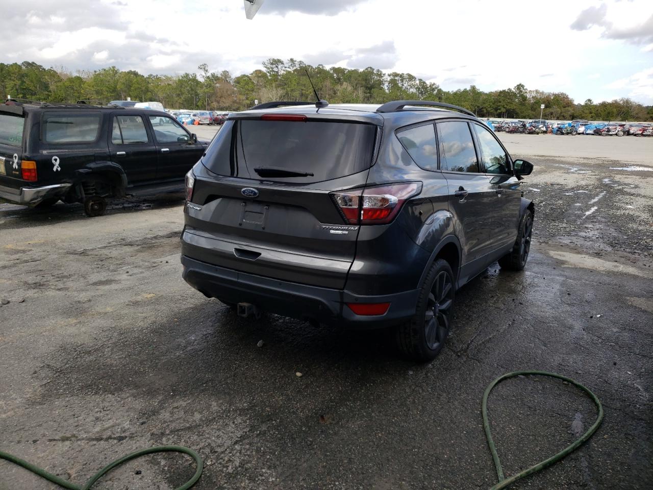Photo 4 from auction – 2017 FORD ESCAPE TIT with VIN 1FMCU9J92HUD49762