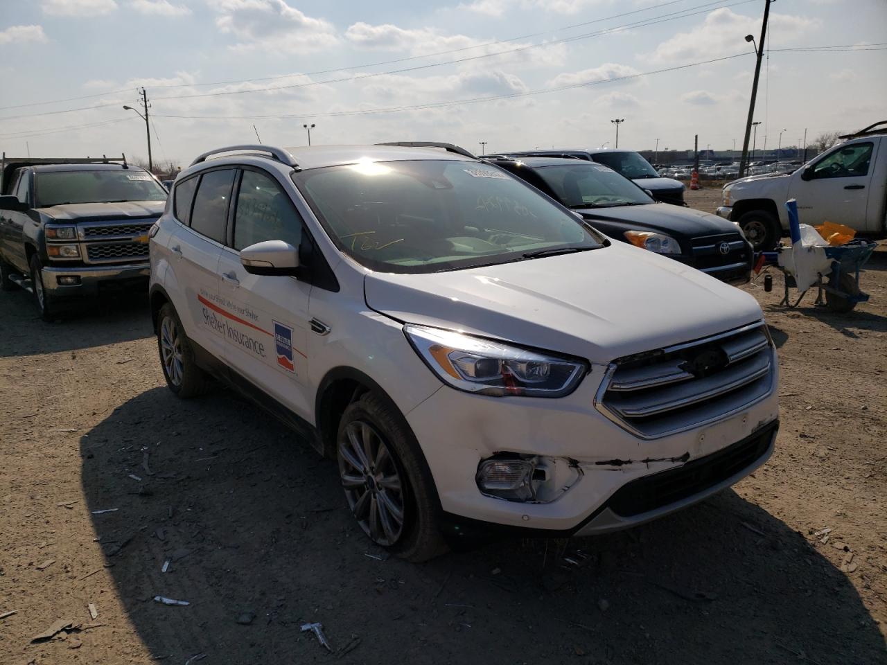 FORD ESCAPE TIT 2018 with VIN 1FMCU0J90JUD06135 - Photo from auction