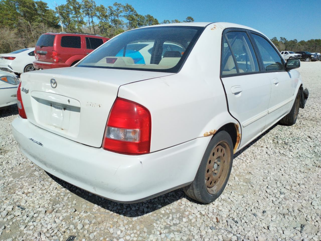 Photo 4 from auction – 2002 MAZDA PROTEGE DX with VIN JM1BJ225920534059