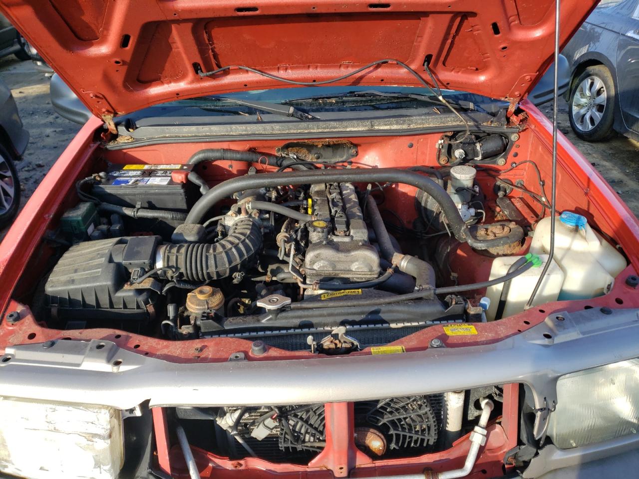 Photo 7 from auction – 2000 CHEVROLET TRACKER with VIN 2CNBJ13C6Y6927729