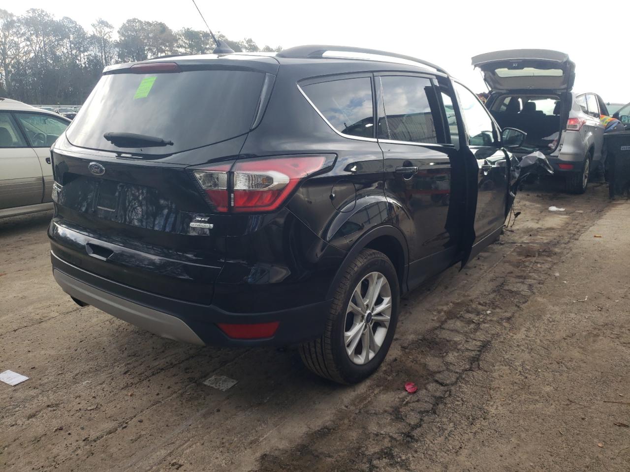 Photo 4 from auction – 2018 FORD ESCAPE SE with VIN 1FMCU0GD4JUC03490