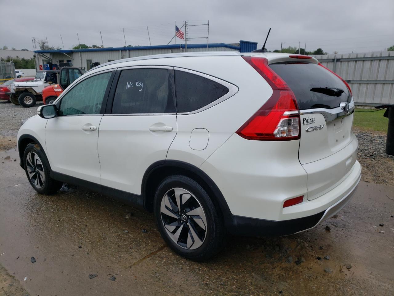 Photo 3 from auction – 2015 HONDA CR-V TOURI with VIN 5J6RM3H98FL020207