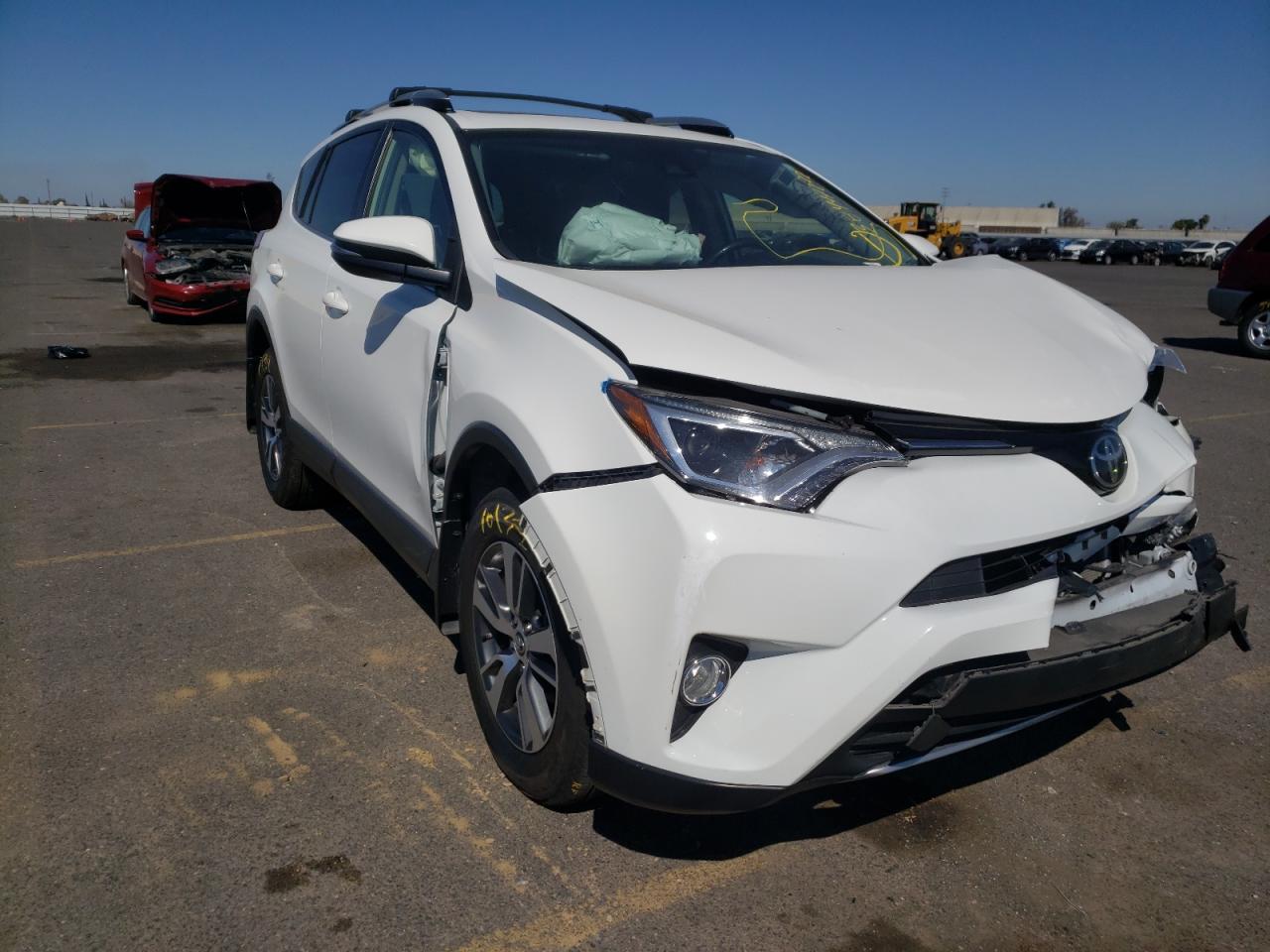 TOYOTA RAV4 XLE 2017 with VIN JTMWFREV5HJ137796 - Photo from auction