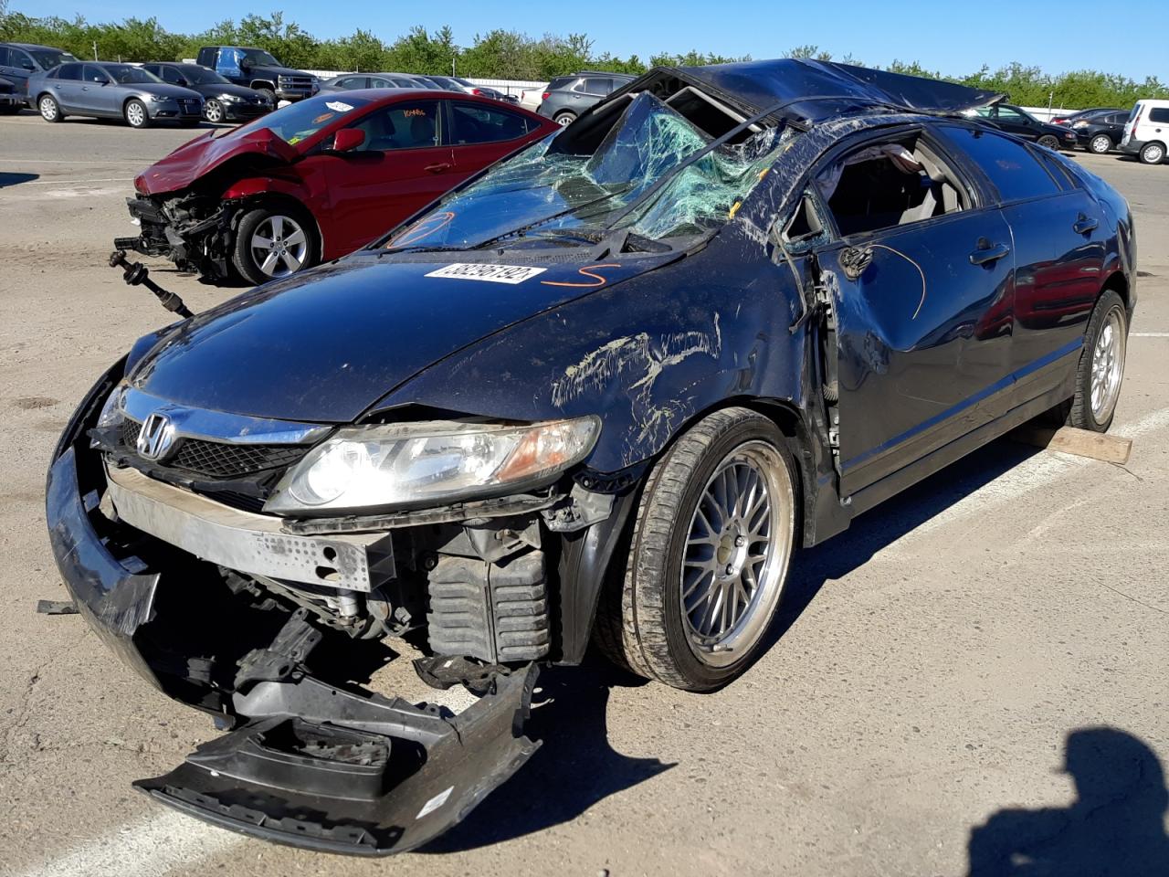 Photo 2 from auction – 2011 HONDA CIVIC LX with VIN 19XFA1F51BE049928