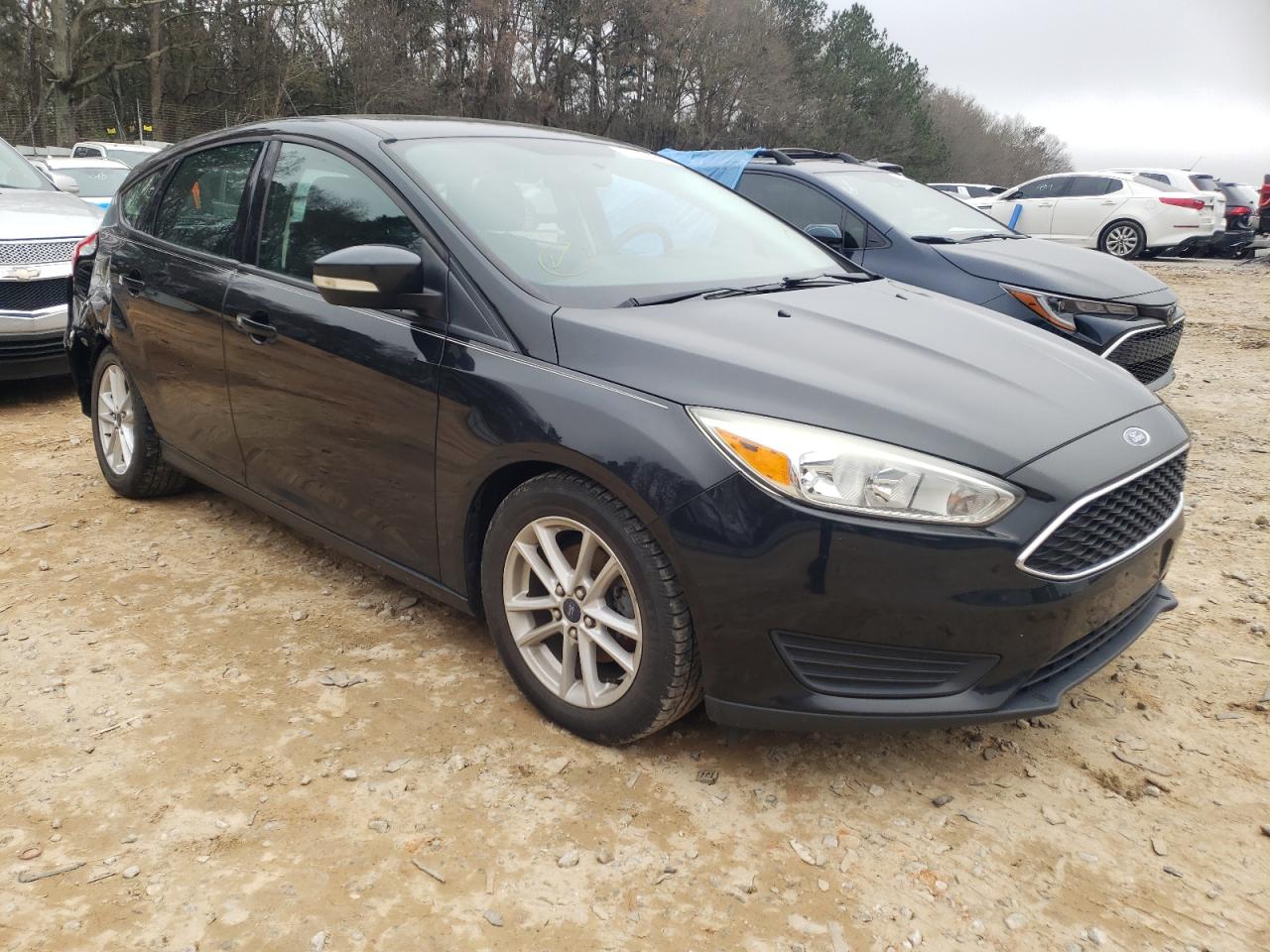 FORD FOCUS SE 2015 with VIN 1FADP3K21FL343734 - Photo from auction