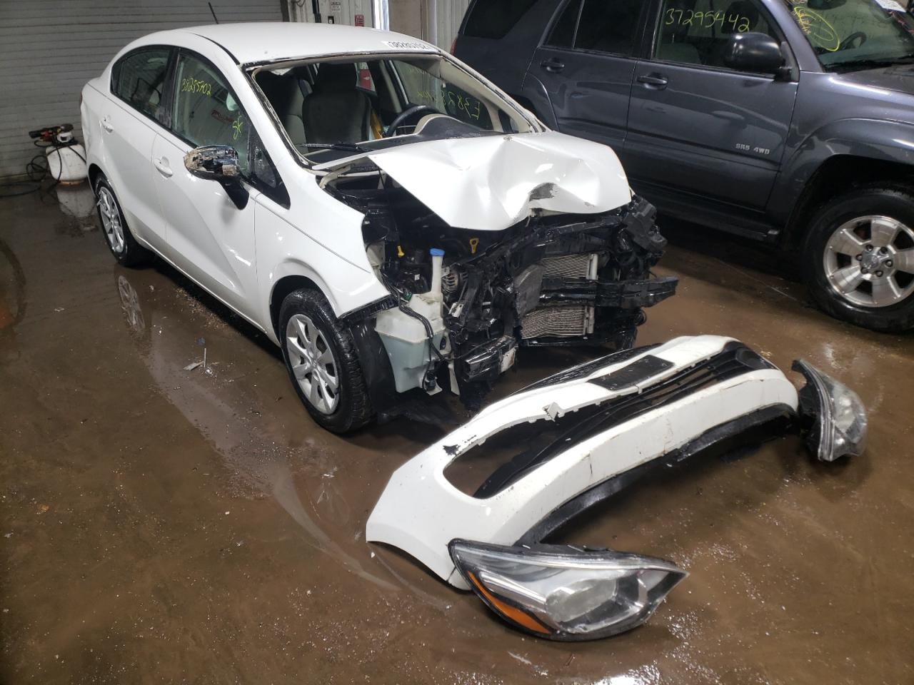 KIA RIO LX 2014 with VIN KNADM4A38E6401397 - Photo from auction