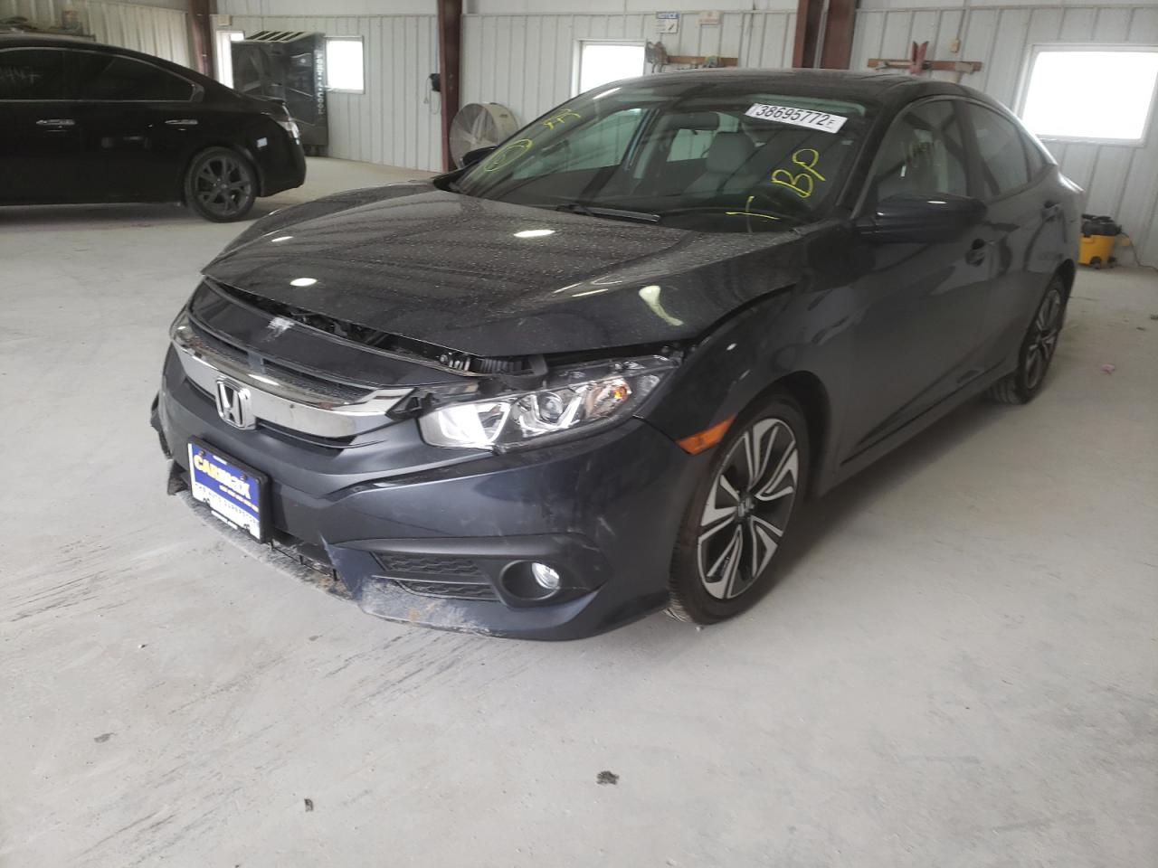 Photo 2 from auction – 2016 HONDA CIVIC EX with VIN 19XFC1F38GE202028
