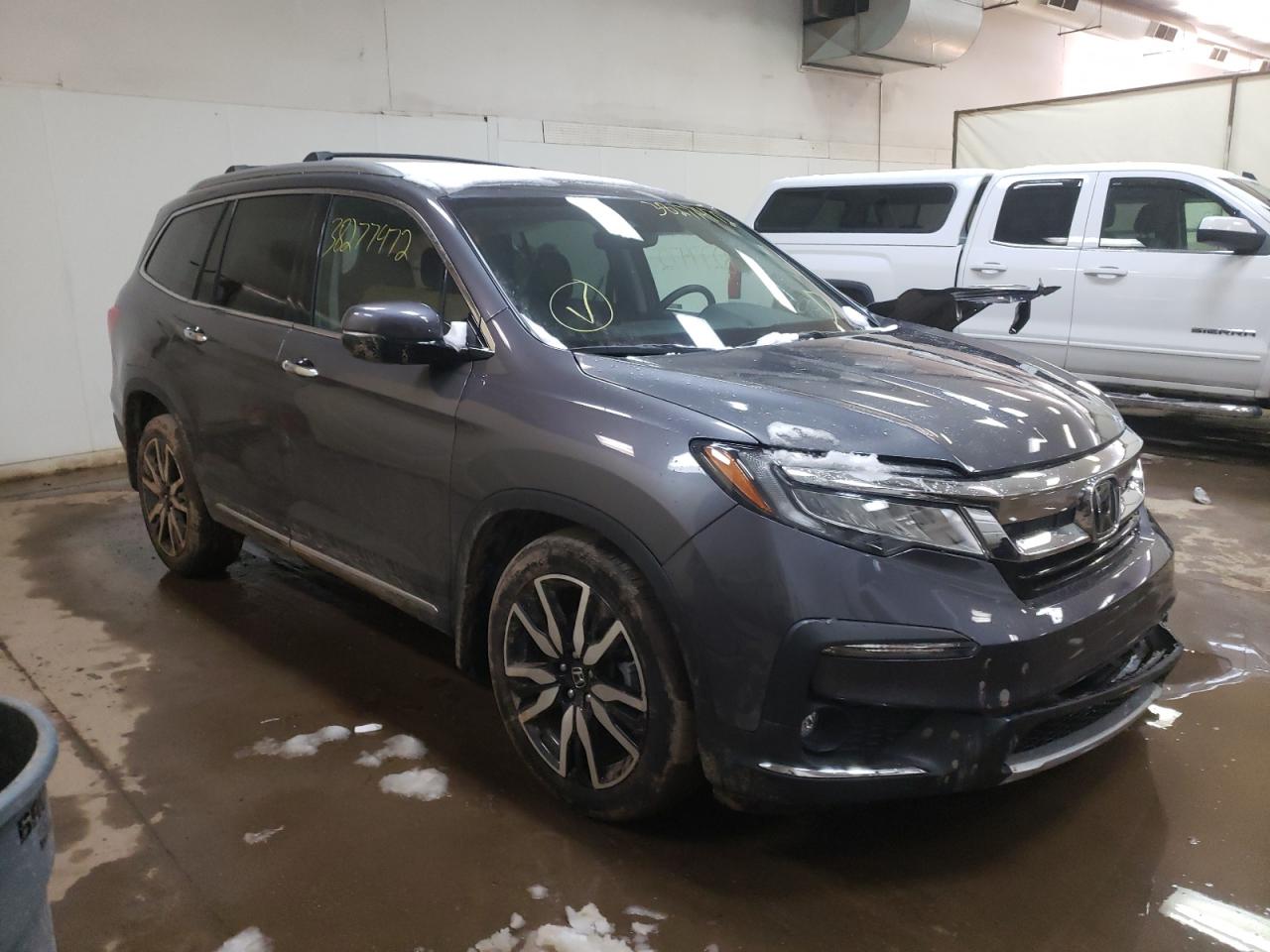 HONDA PILOT ELIT 2021 with VIN 5FNYF6H06MB008510 - Photo from auction