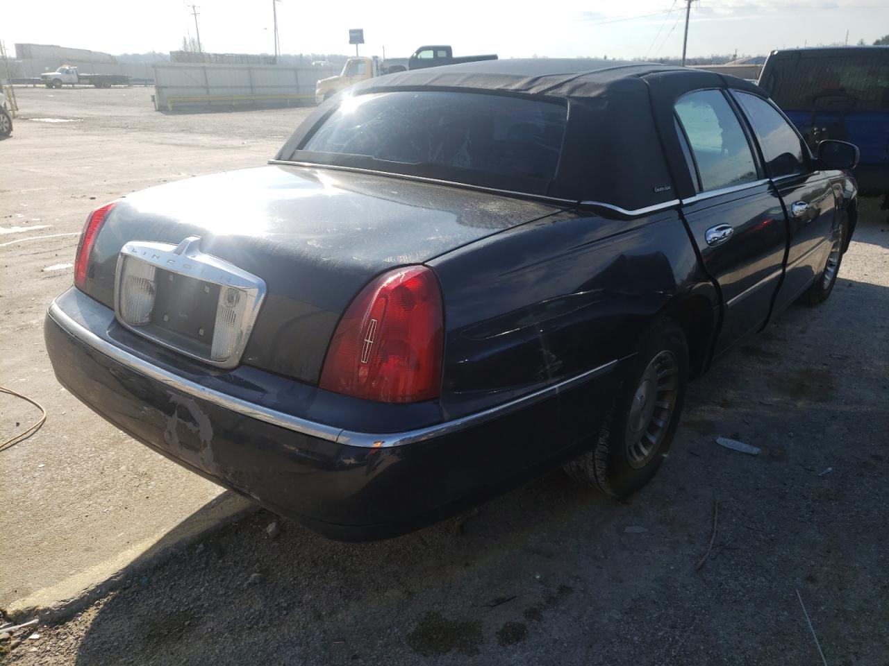 Photo 4 from auction – 1999 LINCOLN TOWN CAR E with VIN 1LNHM81W2XY648522