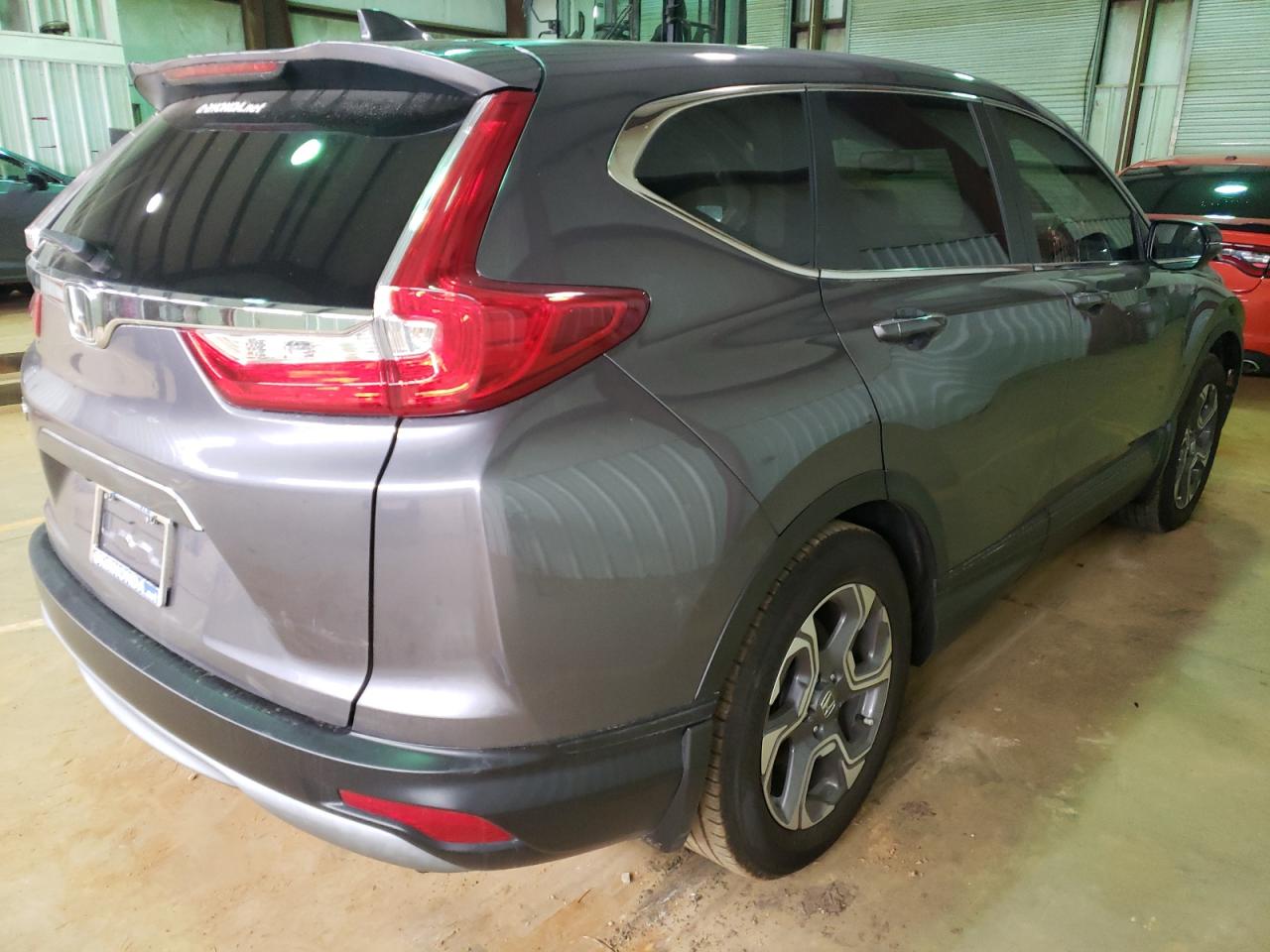 Photo 4 from auction – 2018 HONDA CR-V EXL with VIN 7FARW1H83JE034205