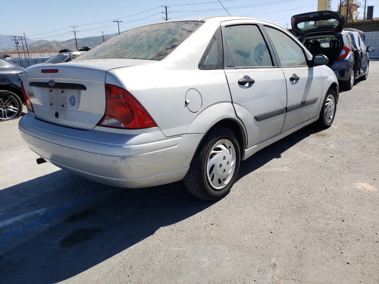 Photo 4 from auction – 2003 FORD FOCUS LX with VIN 1FAFP33P03W108688