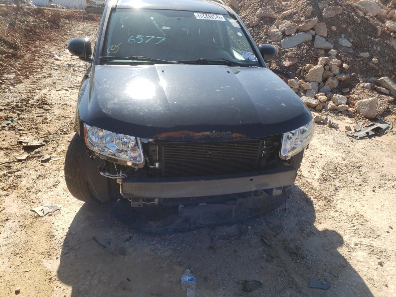 Photo 9 from auction – 2014 JEEP COMPASS LA with VIN 1C4NJCEAXED666577