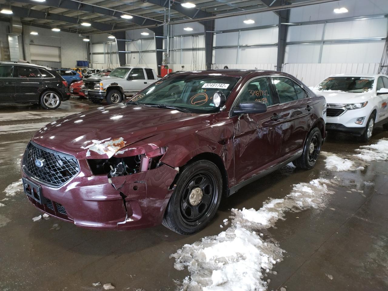 Photo 2 from auction – 2015 FORD TAURUS POL with VIN 1FAHP2MKXFG129410