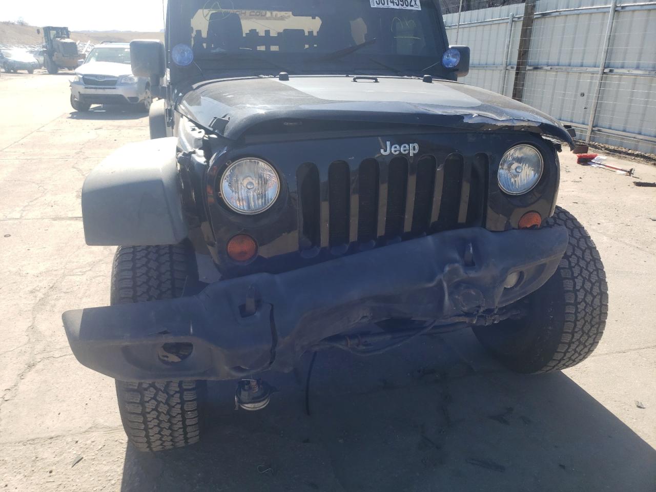 Photo 9 from auction – 2011 JEEP WRANGLER R with VIN 1J4BA6D14BL543990