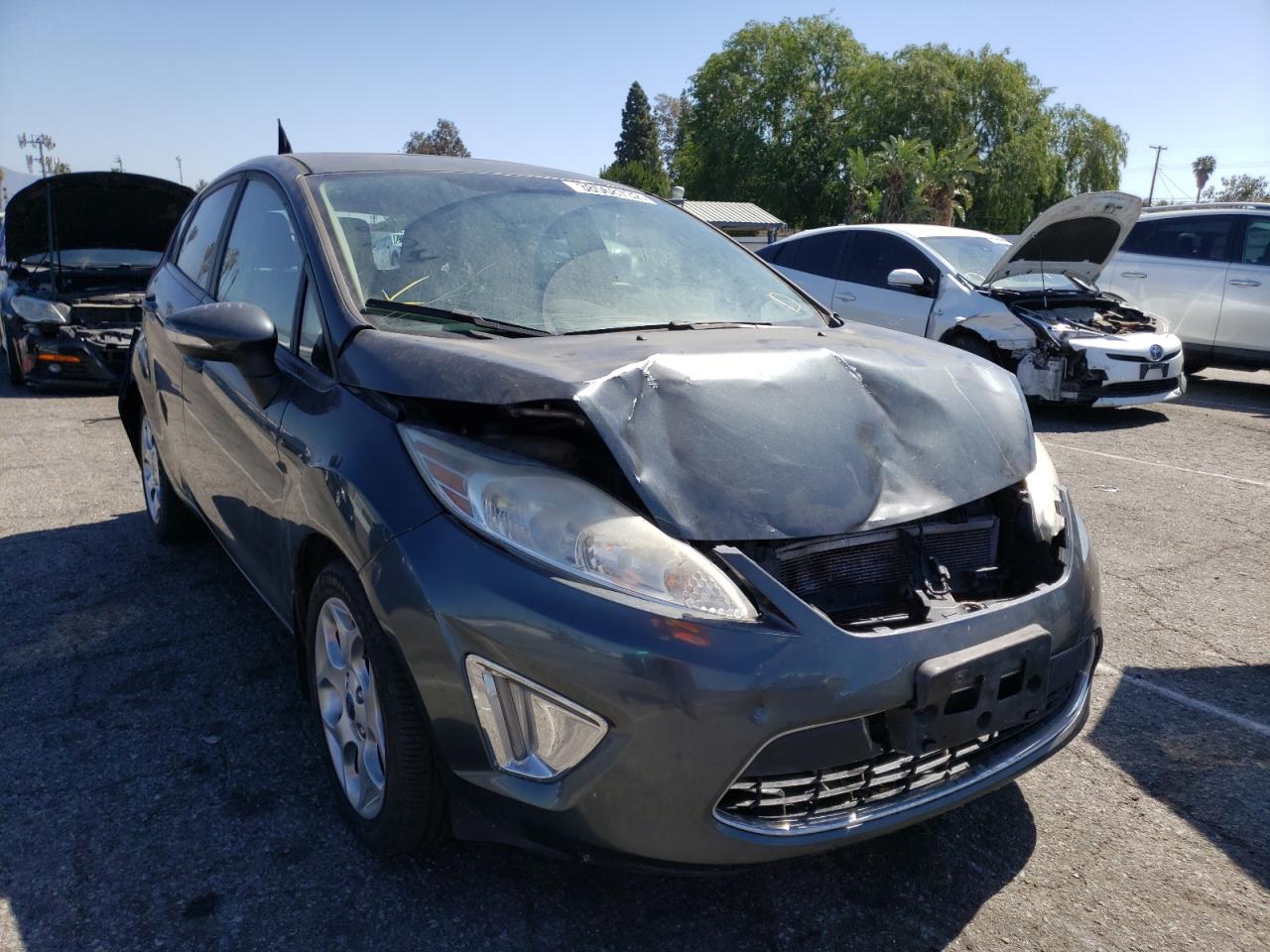 FORD FIESTA SES 2011 with VIN 3FADP4FJXBM200569 - Photo from auction