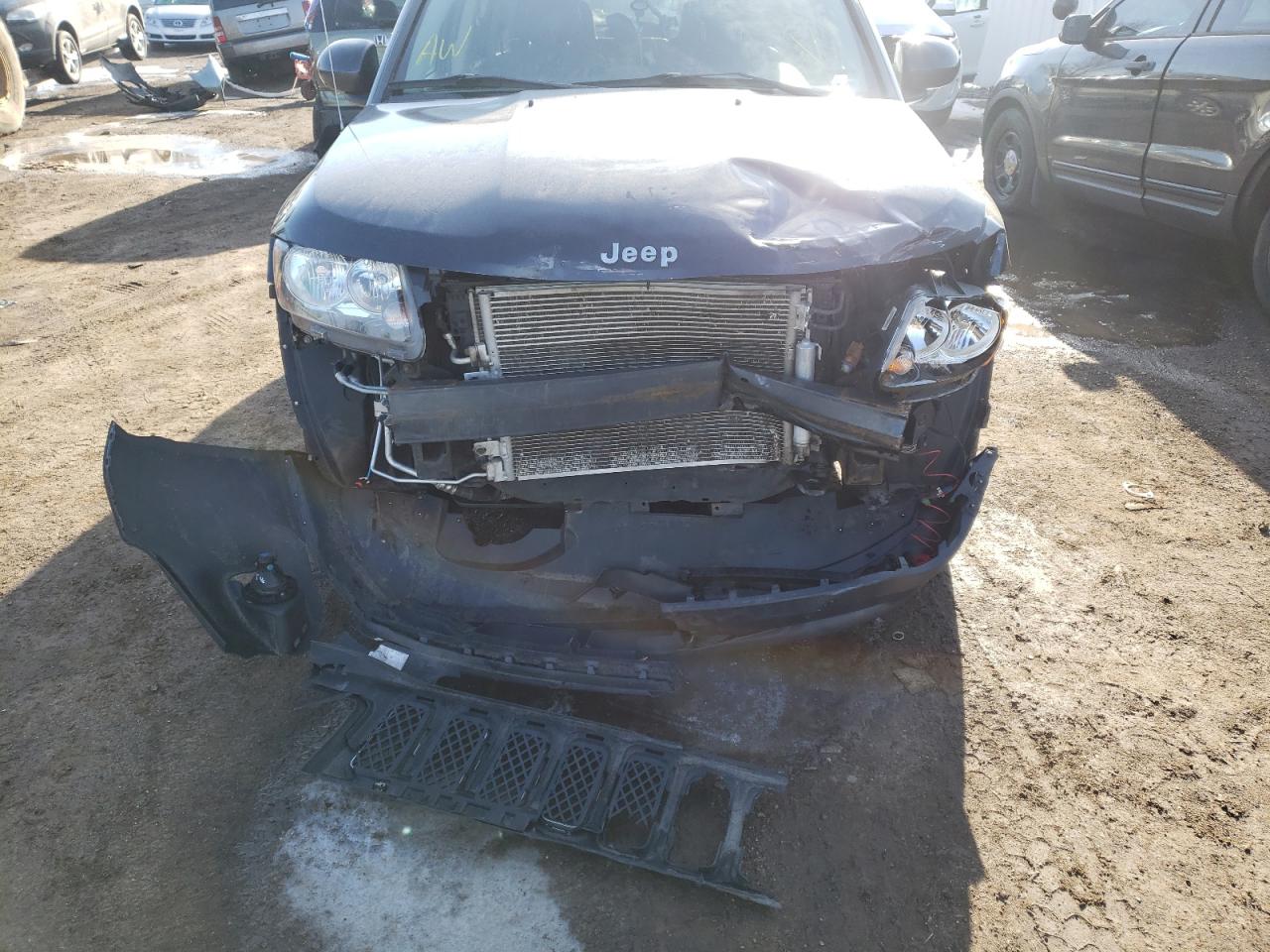 Photo 9 from auction – 2014 JEEP COMPASS LA with VIN 1C4NJDEB6ED765640