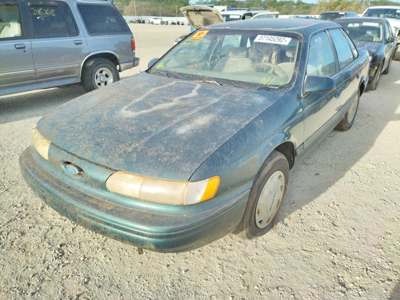 Photo 2 from auction – 1994 FORD TAURUS GL with VIN 1FALP5249RG104003