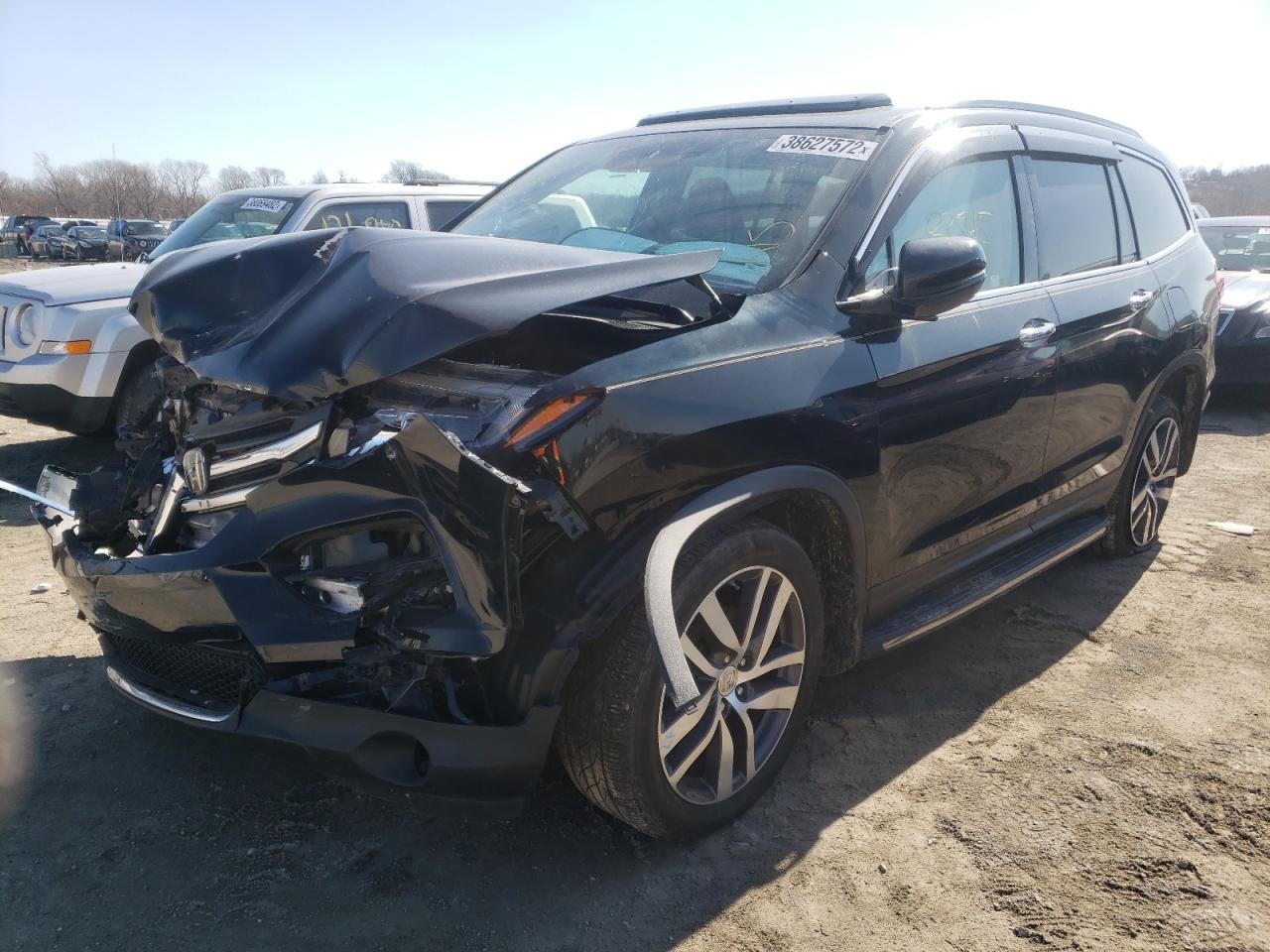 Photo 2 from auction – 2017 HONDA PILOT TOUR with VIN 5FNYF5H93HB002808