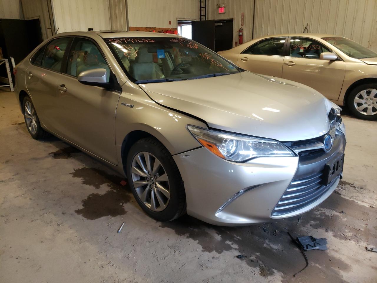 TOYOTA CAMRY HYBR 2015 with VIN 4T1BD1FK3FU169163 - Photo from auction
