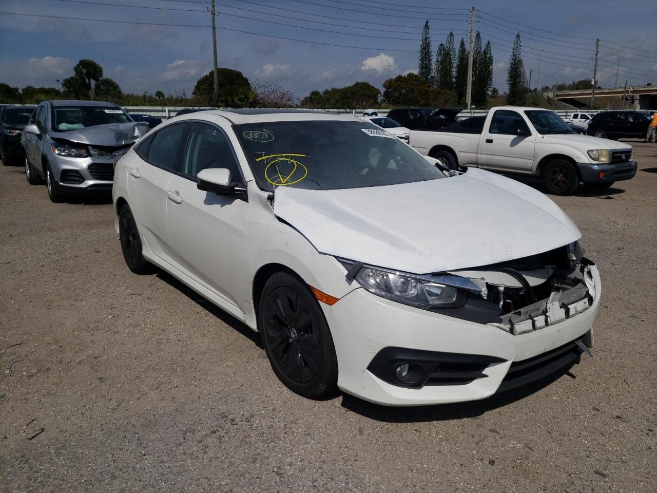 HONDA CIVIC EX 2017 with VIN 19XFC1F31HE203832 - Photo from auction
