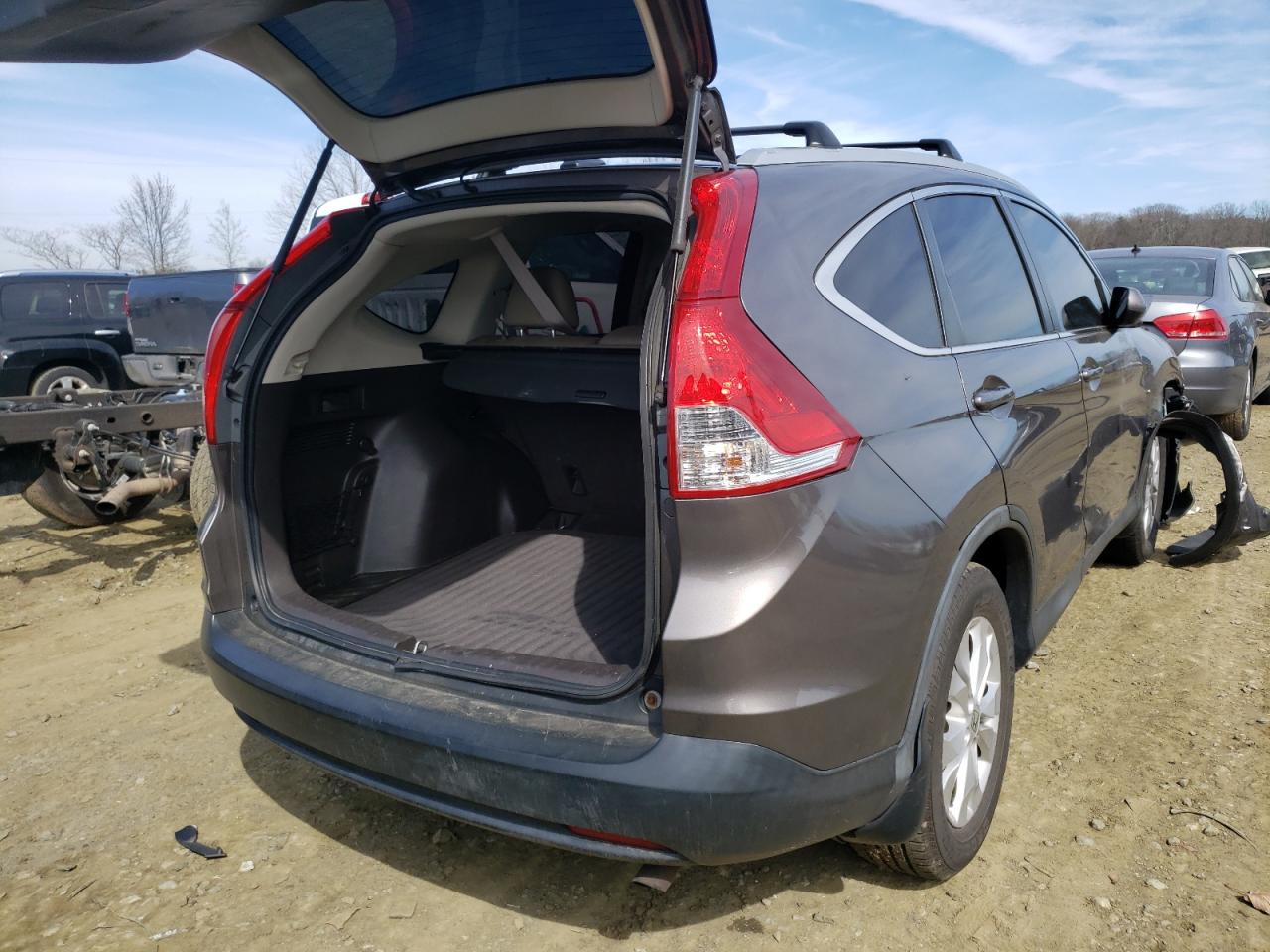 Photo 4 from auction – 2014 HONDA CR-V EXL with VIN 2HKRM4H74EH675445