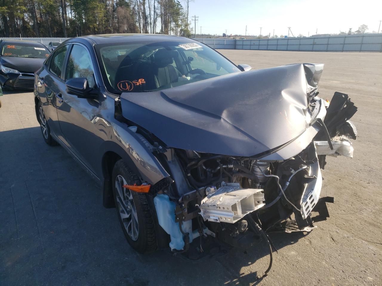 HONDA CIVIC EX 2017 with VIN 19XFC2F73HE205560 - Photo from auction