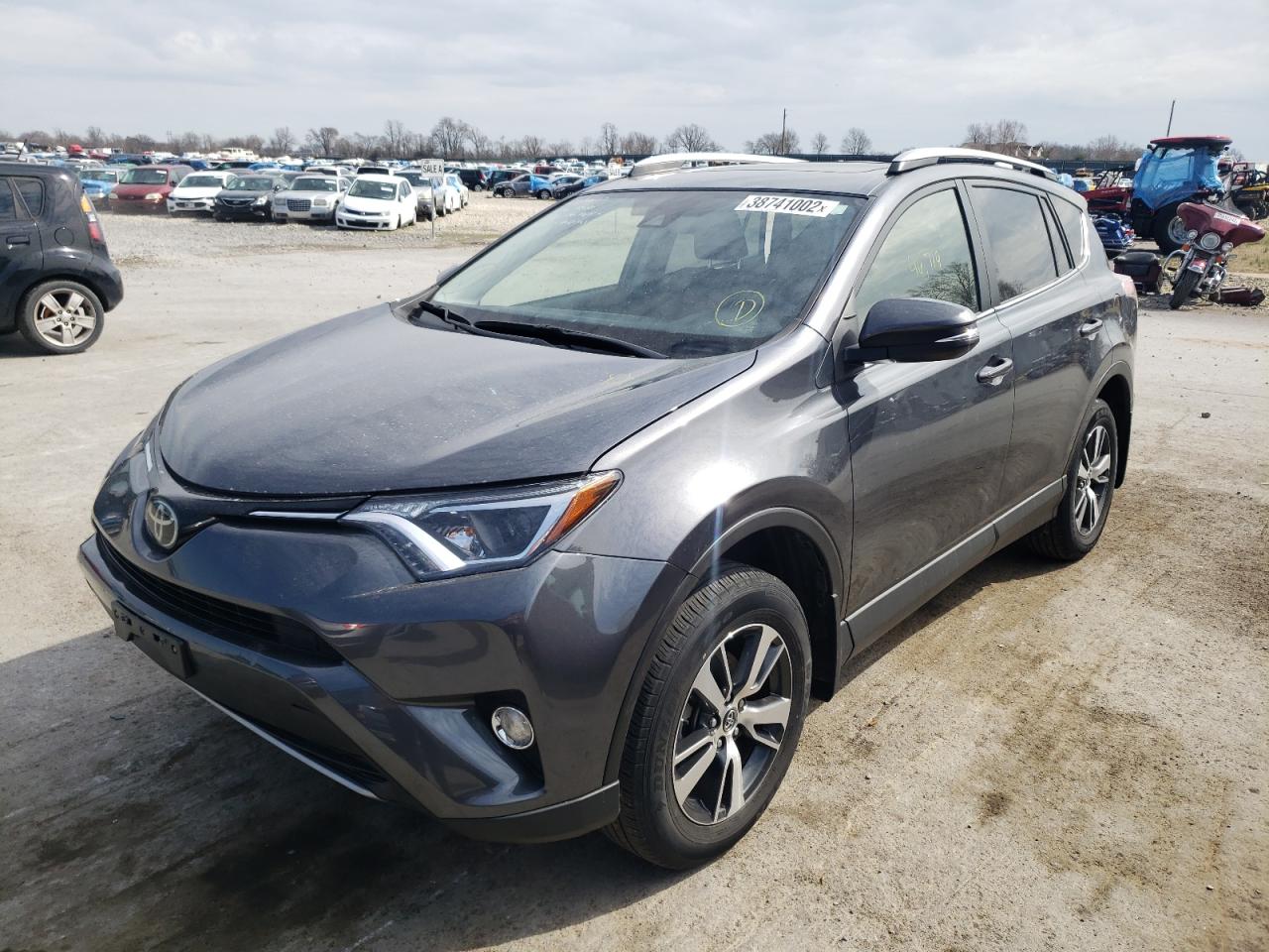 Photo 2 from auction – 2018 TOYOTA RAV4 with VIN JTMRFREV6JD248374