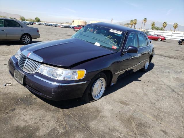 Photo 2 from auction – 2000 LINCOLN TOWN CAR E with VIN 1LNHM81W7YY914456