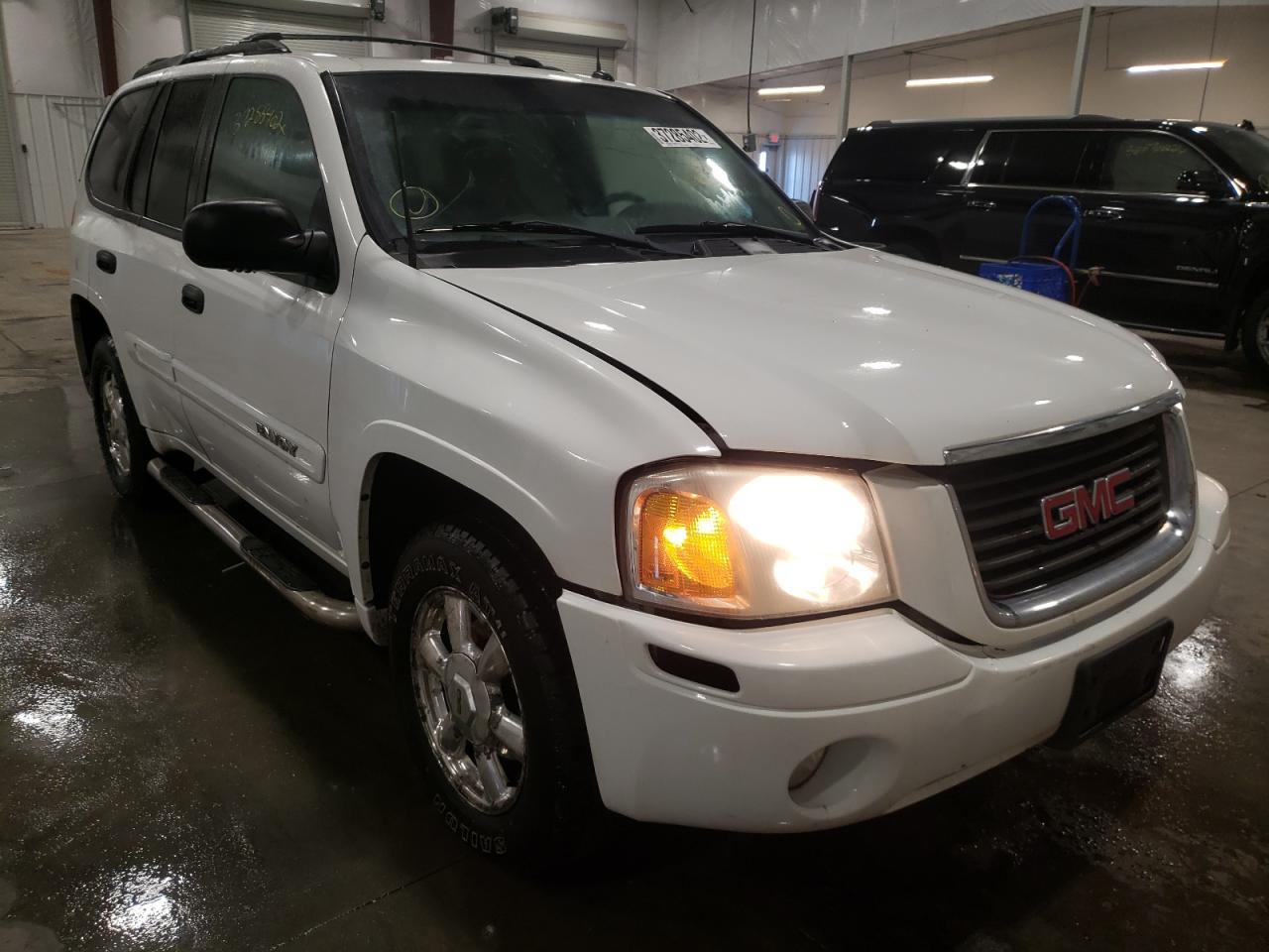 GMC ENVOY SLE 2005 with VIN 1GKDT13SX52369749 - Photo from auction
