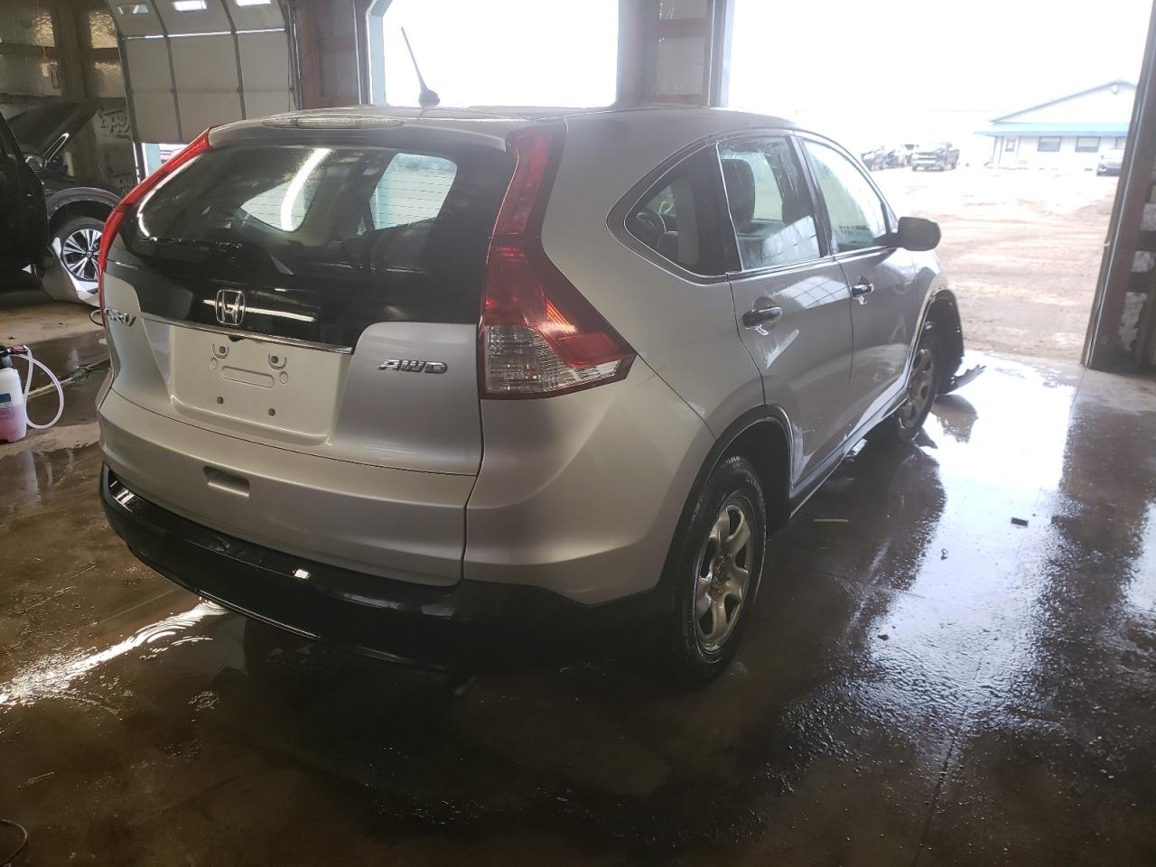 Photo 4 from auction – 2013 HONDA CR-V LX with VIN 5J6RM4H32DL010934