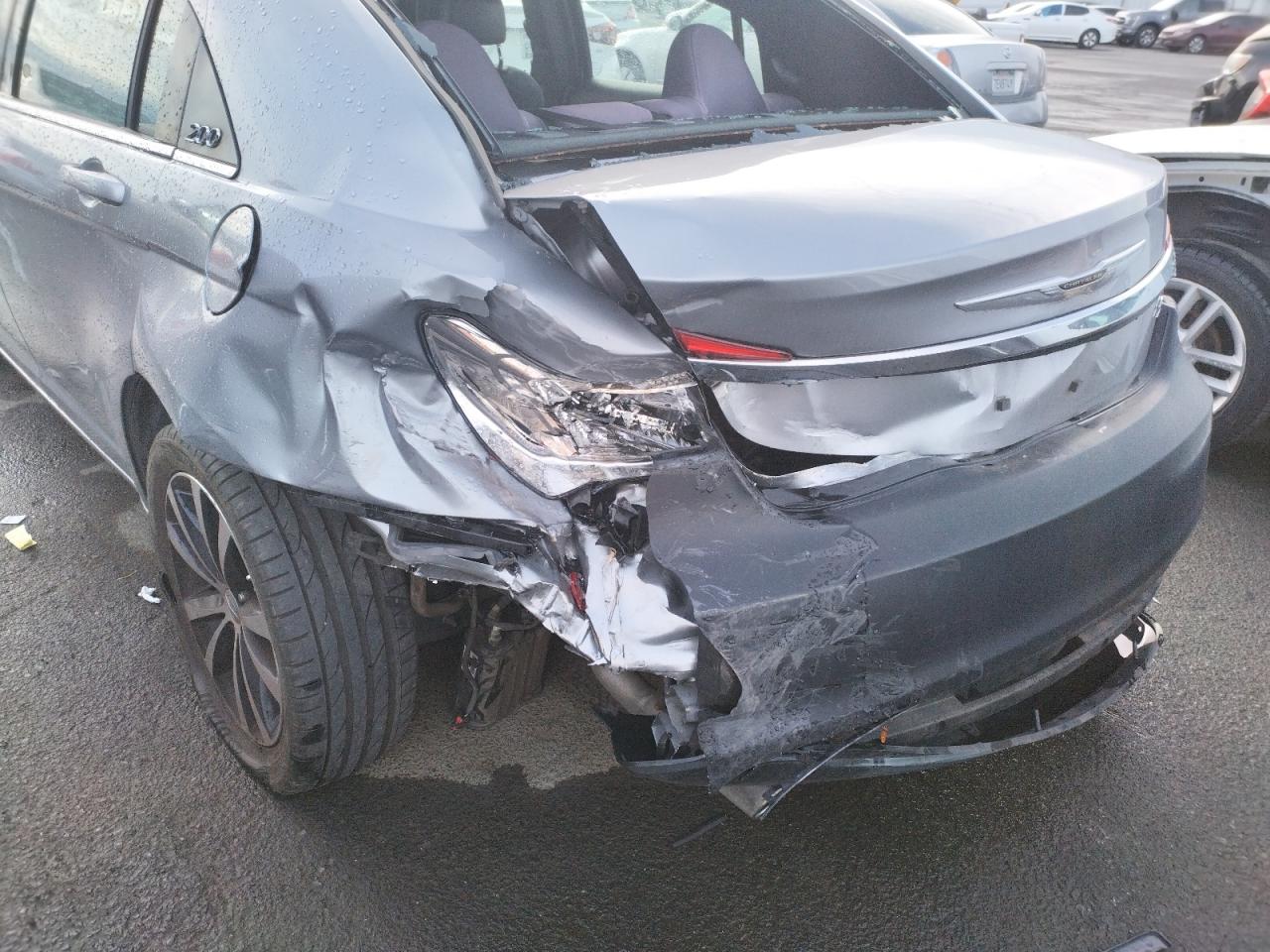 Photo 9 from auction – 2013 CHRYSLER 200 TOURIN with VIN 1C3CCBBG0DN718302