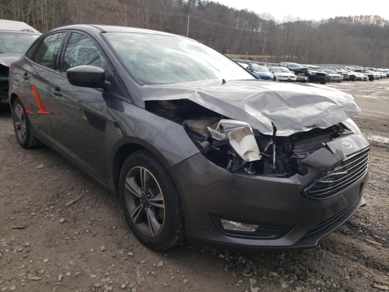 FORD FOCUS SE 2018 with VIN 1FADP3FEXJL235030 - Photo from auction