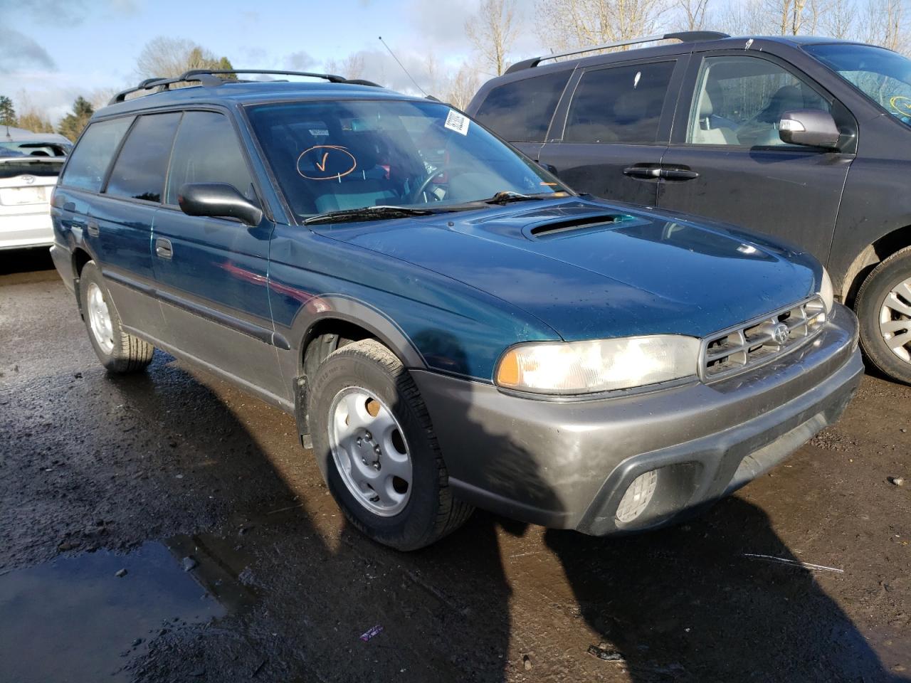 SUBARU LEGACY OUT 1997 with VIN 4S3BG685XV7650010 - Photo from auction