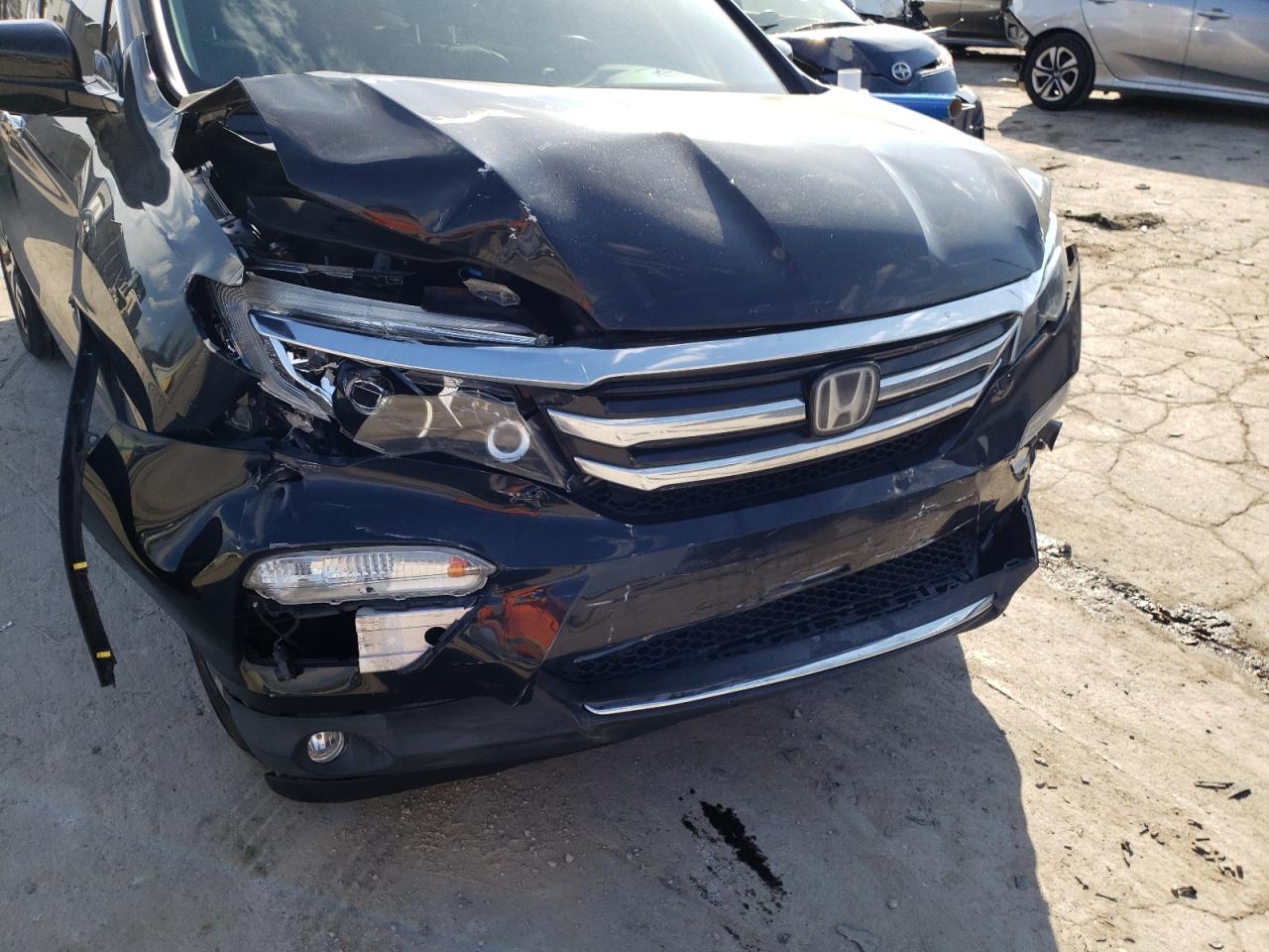 Photo 9 from auction – 2016 HONDA PILOT ELIT with VIN 5FNYF6H01GB002523