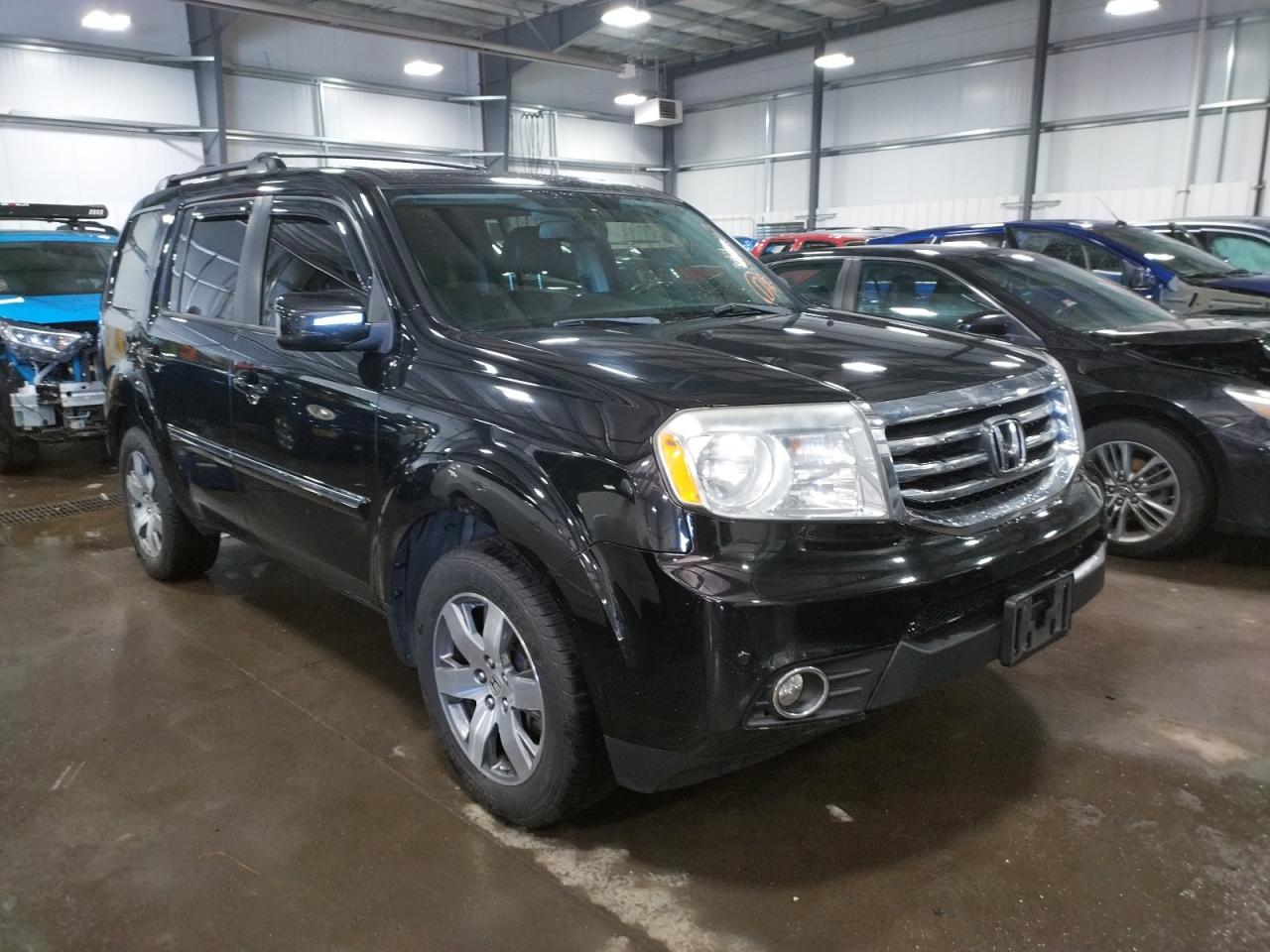 HONDA PILOT TOUR 2014 with VIN 5FNYF4H98EB006858 - Photo from auction