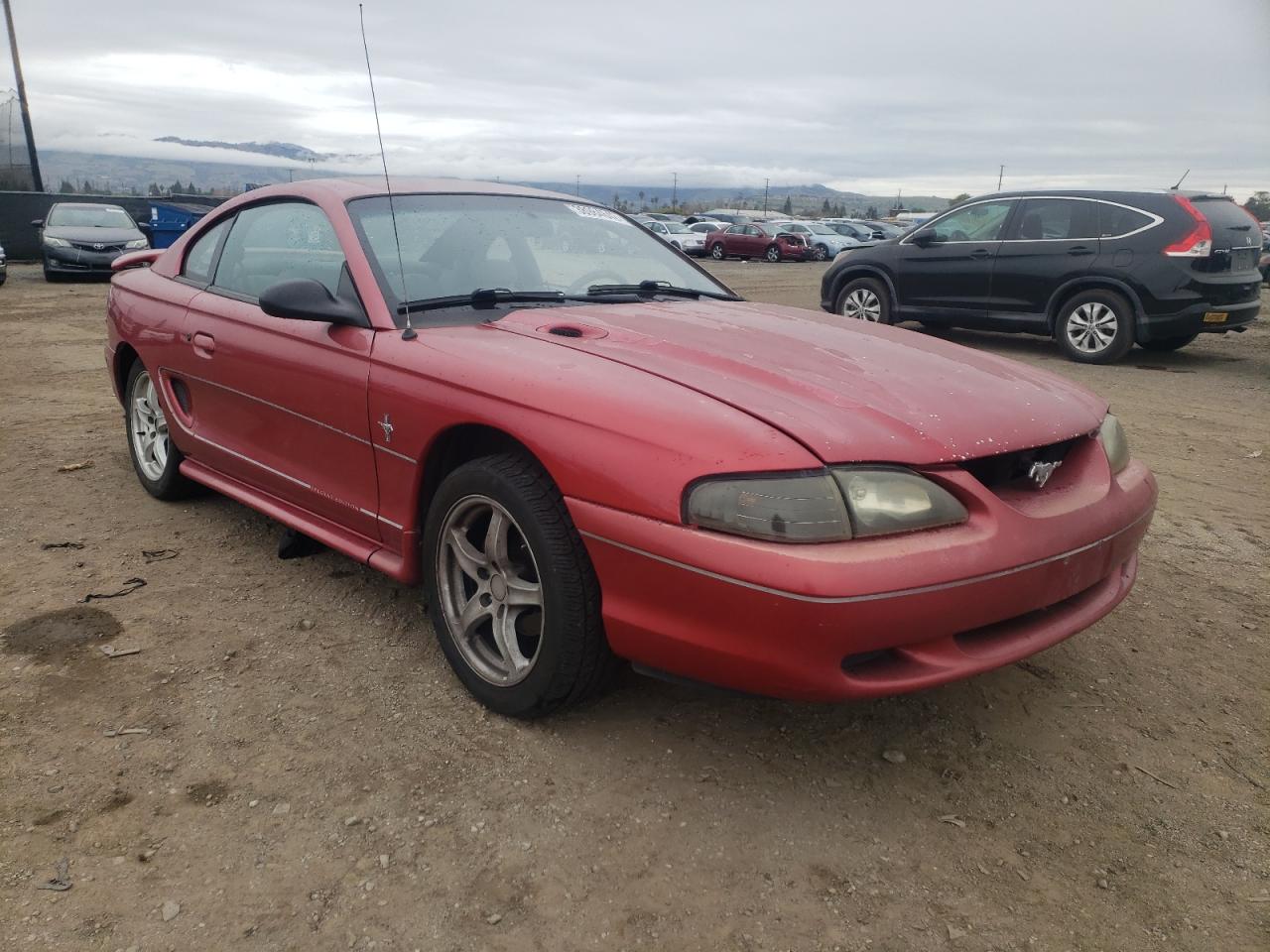 FORD MUSTANG 1998 with VIN 1FAFP404XWF207071 - Photo from auction
