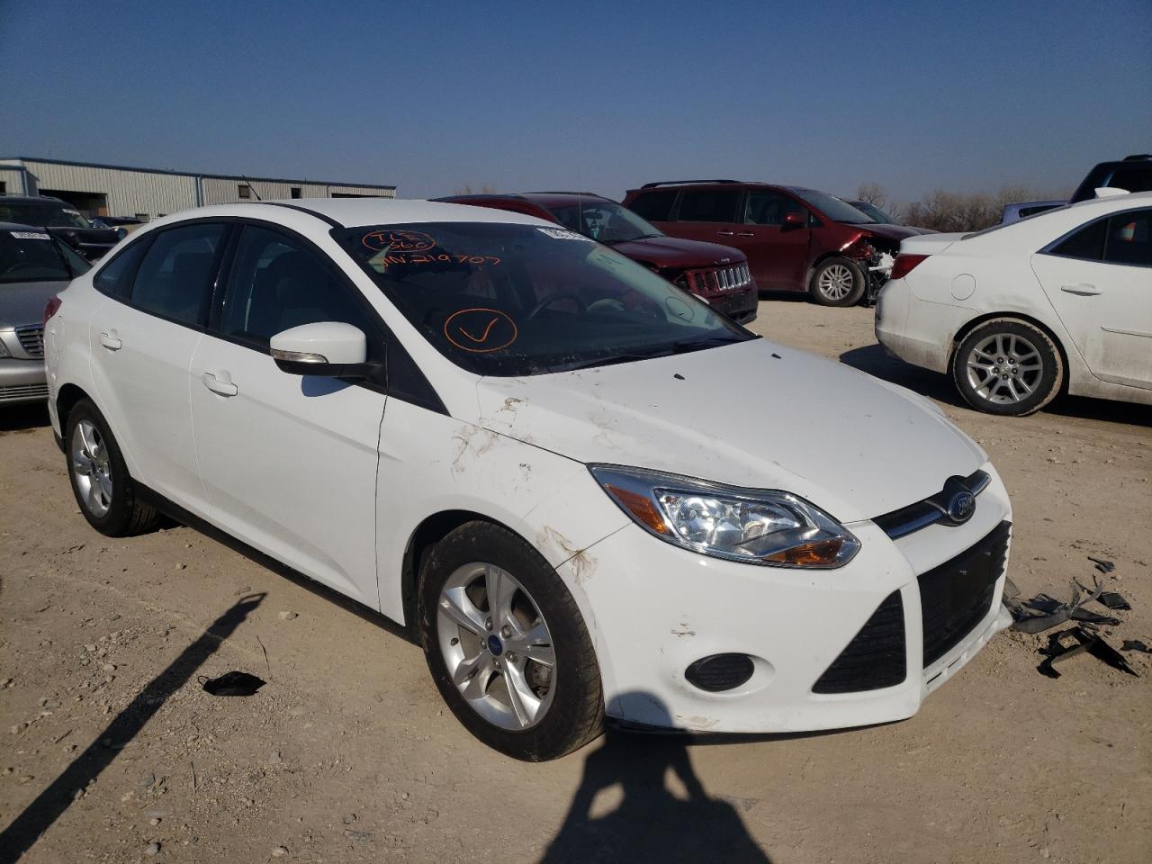 FORD FOCUS SE 2014 with VIN 1FADP3F22EL219707 - Photo from auction