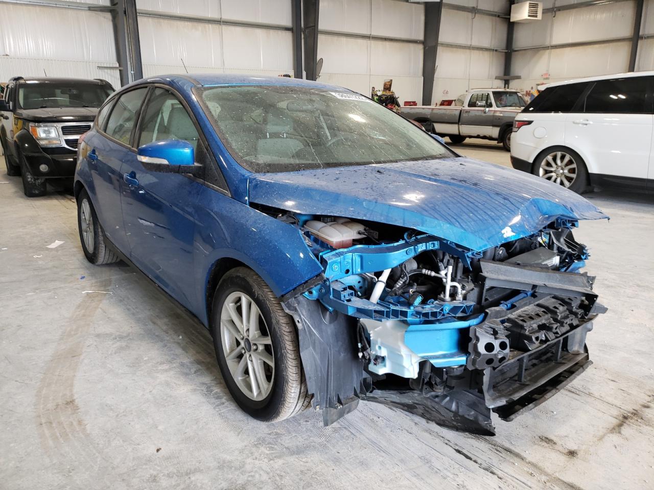 FORD FOCUS SE 2015 with VIN 1FADP3K23FL220842 - Photo from auction