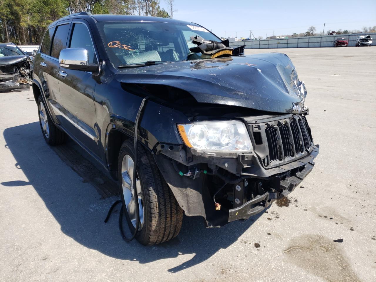 JEEP GRAND CHER 2011 with VIN 1J4RR5GT9BC569810 - Photo from auction