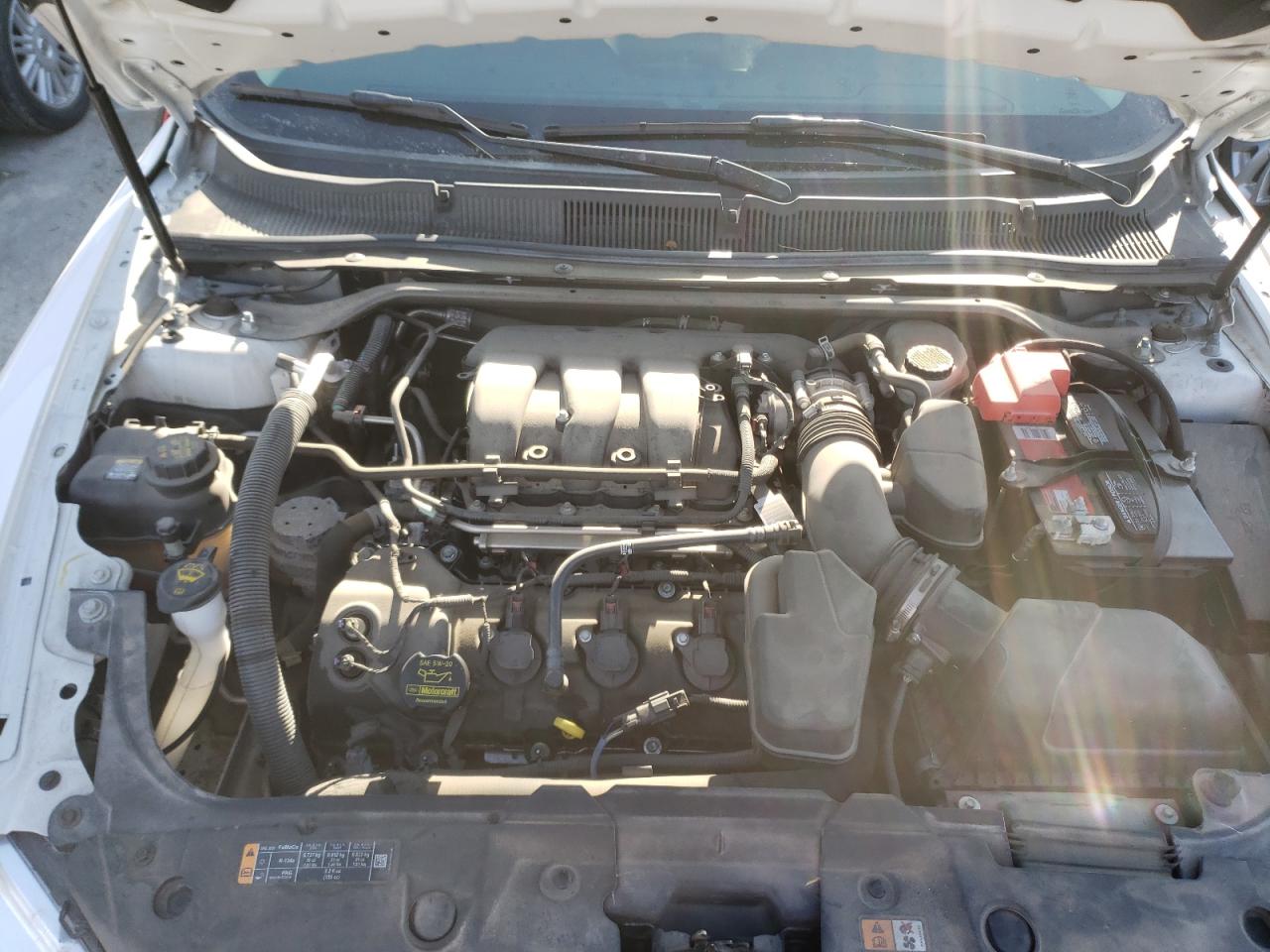 Photo 7 from auction – 2013 FORD TAURUS SEL with VIN 1FAHP2E80DG220525
