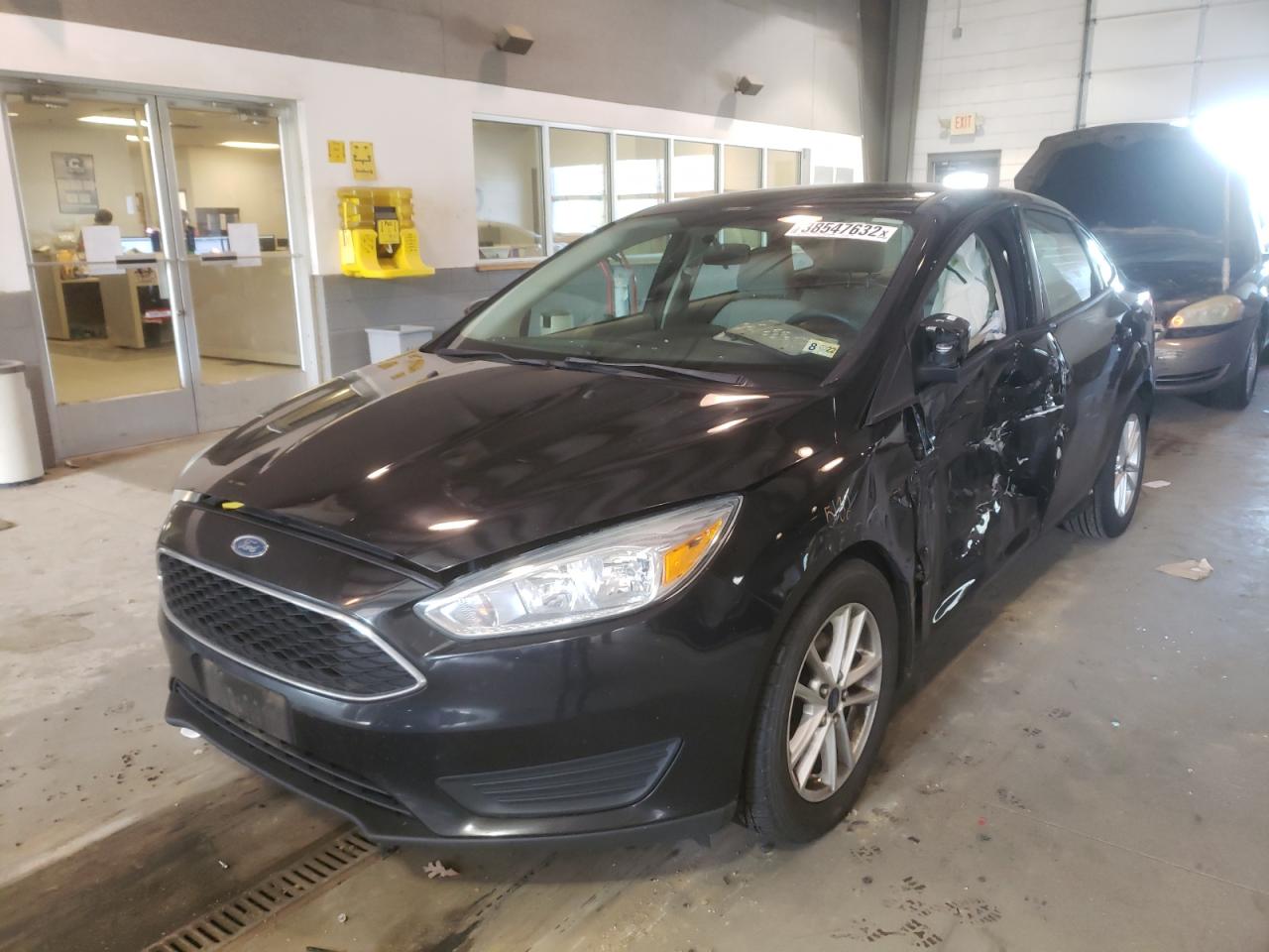 Photo 2 from auction – 2015 FORD FOCUS SE with VIN 1FADP3F27FL259959